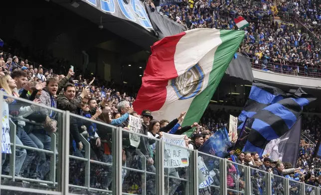 Inter Milan fans celebrate at the end of a Serie A soccer match between Inter Milan and Torino at the San Siro stadium in Milan, Italy, Sunday, April 28, 2024. Inter Milan had already clinched the Italian Serie A league title the week before. (AP Photo/Luca Bruno)