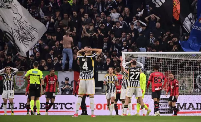 Juventus' players are dejected at the end of a Serie A soccer match between Juventus and Milan at the Allianz Stadium in Turin, Italy, Saturday, April 27, 2024. The match ended 0-0. (Marco Alpozzi/LaPresse via AP)