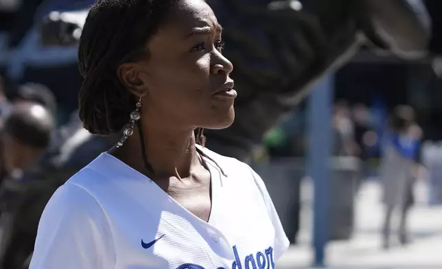 Ayo Robinson, the granddaughter of baseball great Jackie Robinson, attends a celebration for Jackie Robinson Day at Dodgers Stadium before a game between the Dodgers and the Washington Nationals in Los Angeles, Monday, April 15, 2024. (AP Photo/Damian Dovarganes)