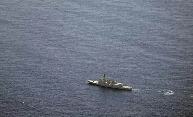 A Japan's Maritime Self-Defense Force vessel sails near the site of a crash in the Pacific Ocean Sunday, April 21, 2024. Two Japanese navy helicopters carrying eight crew members crashed in the Pacific Ocean south of Tokyo during a nighttime training flight after possibly colliding with each other, the country's defense minister said Sunday. (Kyodo News via AP)