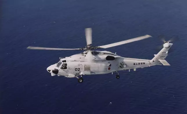 This undated photo released by and taken from the official website of the Japan Maritime Self-Defense Force, shows a SH-60K chopper. Two Japanese navy helicopters of the same type crashed in the Pacific Ocean south of Tokyo during a nighttime training flight after possibly colliding with each other, the country's defense minister said Sunday, April 21, 2024. (The official website of the Japan Maritime Self-Defense Force via AP)