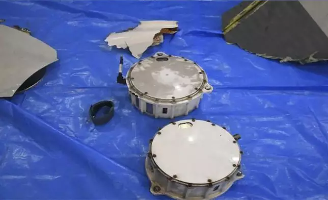 This image released by Japan Maritime Self-Defense Force shows the retrieved components which are believed to be a part of a crashed helicopter, Sunday, April 21, 2024. Initial analysis of flight data recorders recovered from the waters in the Pacific near the crash site of the two Japanese navy helicopters showed no sign that mechanical problems in the aircraft caused the accident, Japan’s defense minister said Monday, as he indicated human error. (Japan Maritime Self-Defense Force via AP)