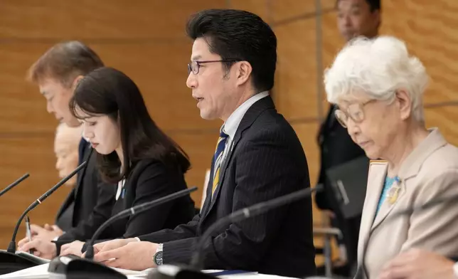 Takuya Yokota, Secretary-General of the Association of Families of Victims Kidnapped by North Korea, center, speaks to U.S. Ambassador to United Nations Linda Thomas-Greenfield, not in picture on Thursday, April 18, 2024, at prime minister's office in Tokyo. (AP Photo/Eugene Hoshiko, Pool)