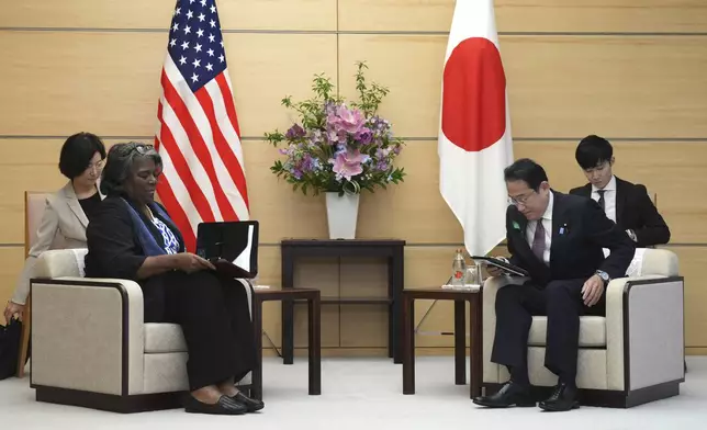 U.S. Ambassador to United Nations Linda Thomas-Greenfield, left, and Japan's Prime Minister Fumio Kishida, right, prepare to talk during a meeting Friday, April 19, 2024, at prime minister's office in Tokyo. (AP Photo/Eugene Hoshiko, Pool)