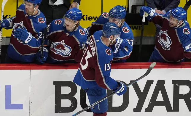 Colorado Avalanche right wing Valeri Nichushkin, front, is congratulated for a goal against the Winnipeg Jets during the third period of Game 3 of an NHL hockey Stanley Cup first-round playoff series Friday, April 26, 2024, in Denver. (AP Photo/David Zalubowski)