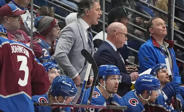 Colorado Avalanche head coach Jared Bednar, center top, directs his team in the second period of Game 4 of an NHL Stanley Cup first-round playoff series against he Winnipeg Jets Sunday, April 28, 2024, in Denver. (AP Photo/David Zalubowski)