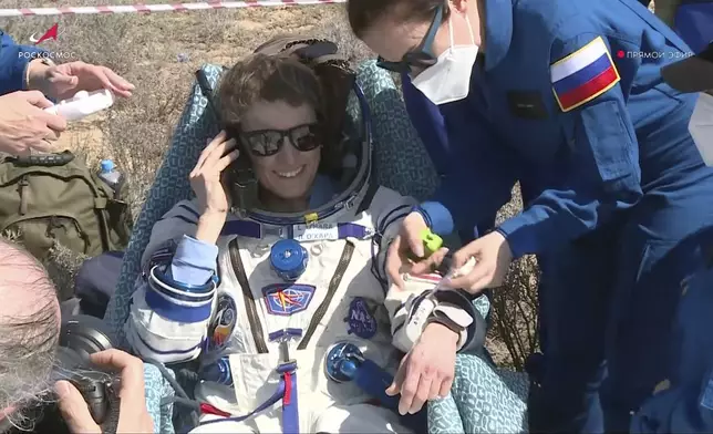 In this grab taken from video released by the Roscosmos Space Corporation, NASA astronaut Loral O'Hara sits in a chair shortly after the landing of the Russian Soyuz MS-24 space capsule near the town of Zhezkazgan, Kazakhstan, Saturday, April 6, 2024. The Soyuz capsule carrying NASA astronaut Loral O'Hara, Oleg Novitsky of Roscosmos and Marina Vasilevskaya of Belarus touched down on Saturday. (Roscosmos space corporation via AP)