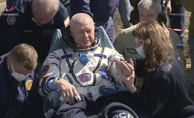 In this grab taken from video released by the Roscosmos Space Corporation, Roscosmos cosmonaut Oleg Novitsky sits in a chair shortly after the landing of the Russian Soyuz MS-24 space capsule near Zhezkazgan, Kazakhstan, Saturday, April 6, 2024. The Soyuz capsule carrying NASA astronaut Loral O'Hara, Oleg Novitsky of Roscosmos and Marina Vasilevskaya of Belarus touched down on Saturday. (Roscosmos Space Corporation via AP)