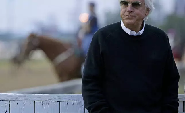FILE - Trainer Bob Baffert watches a workout at Churchill Downs Tuesday, May 3, 2016, in Louisville, Ky. Baffert will miss the race for the third consecutive year. He served a two-year suspension by Churchill Downs Inc. after his 2021 winner Medina Spirit was disqualified for a failed drug test. But the track’s corporate ownership meted out an additional year of punishment. (AP Photo/Charlie Riedel, File)