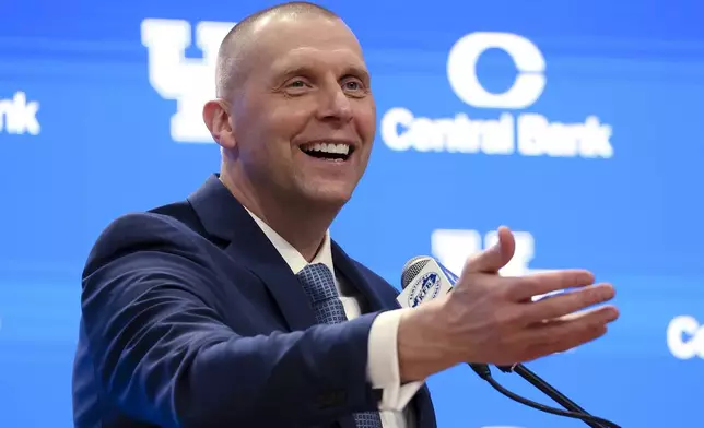 Mark Pope speaks to fans and media after being named Kentucky men's NCAA college basketball head coach in Lexington, Ky., Sunday, April 14, 2024. (AP Photo/James Crisp)