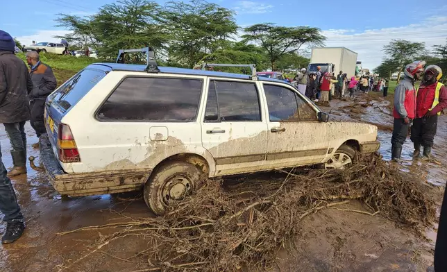 A view of a swept away car after a dam burst, in Kamuchiri Village, Mai Mahiu, Nakuru County, Kenya, Monday, April 29, 2024. Police in Kenya say at least 40 people have died after a dam collapsed in the country's west. (AP Photo)