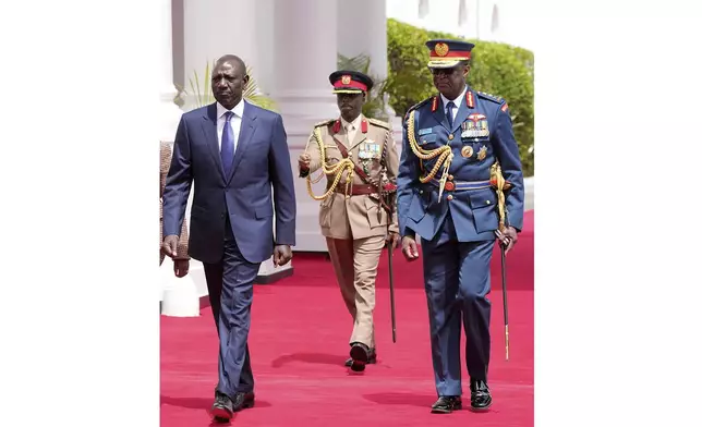 FILE - Kenya's military chief General Francis Ogolla, right, and Kenya's President William Ruto, left, at State House in Nairobi, Kenya, Nov. 14, 2023. Ogolla died in a helicopter crash west of the country, President William Ruto announced Thursday, April 18, 2024, evening and declared three days of national mourning. (AP Photo/Brian Inganga, File)