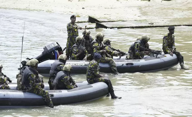 FILE - Kenya's military personnel practice maneuvers as part of Britain's King Charles III's visit to the Mtongwe Naval Base in Mombasa, Kenya, Nov. 2, 2023. Ogolla died in a helicopter crash west of the country, President William Ruto announced Thursday, April 18, 2024, evening and declared three days of national mourning. (AP Photo/Brian Inganga, File)