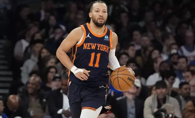 New York Knicks' Jalen Brunson brings the ball up during the first half of the team's NBA basketball game against the Sacramento Kings on Thursday, April 4, 2024, in New York. (AP Photo/Frank Franklin II)