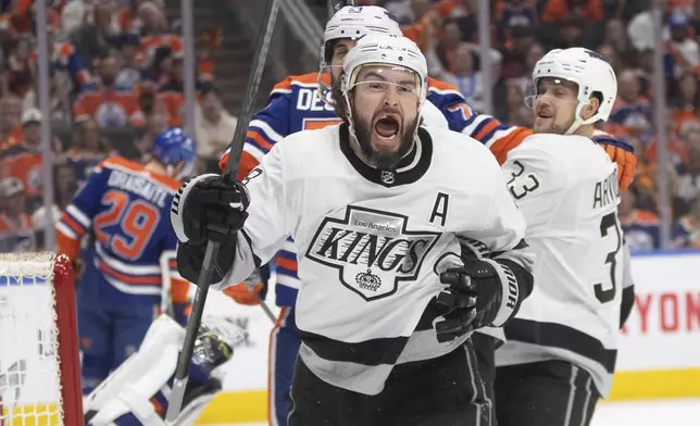 Los Angeles Kings' Drew Doughty (8) celebrates his goal against the Edmonton Oilers during the first period of Game 2 of an NHL hockey Stanley Cup first-round playoff series Wednesday, April 24, 2024, in Edmonton, Alberta. (Jason Franson/The Canadian Press via AP)