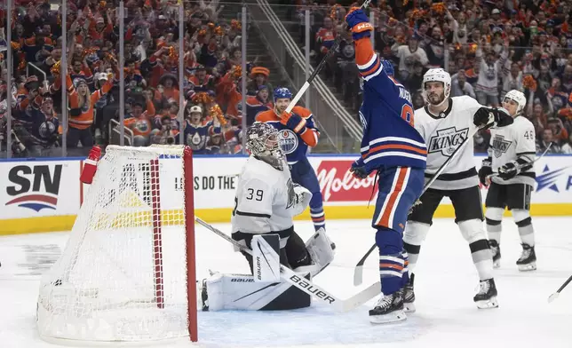 Los Angeles Kings goalie Cam Talbot (39) is scored on by Edmonton Oilers' Ryan Nugent-Hopkins (93) during the second period of Game 1 in first round NHL Stanley Cup playoff hockey action in Edmonton, Alberta, Monday, April 22, 2024. (Jason Franson/The Canadian Press via AP)