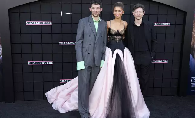 From left, Josh O'Connor, Zendaya and Mike Faist, cast members in "Challengers," pose together at the premiere of the film at the Regency Village Theatre, Tuesday, April 16, 2024, in Los Angeles. (AP Photo/Chris Pizzello)