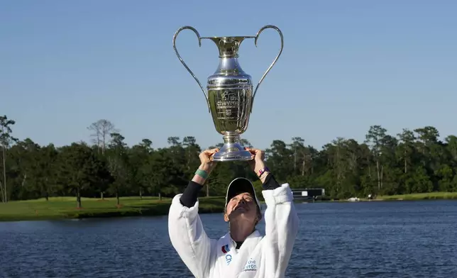 Nelly Korda poses with the trophy after winning the Chevron Championship LPGA golf tournament Sunday, April 21, 2024, at The Club at Carlton Woods in The Woodlands, Texas. (AP Photo/David J. Phillip)