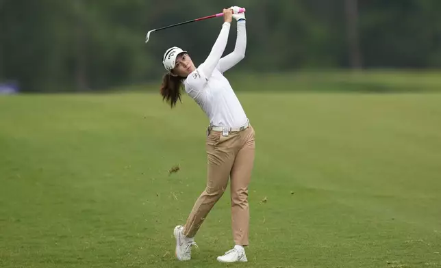 Atthaya Thitikul, of Thailand, hits from the fairway on the second hole during the third round of the Chevron Championship LPGA golf tournament Saturday, April 20, 2024, at The Club at Carlton Woods, in The Woodlands, Texas. (AP Photo/David J. Phillip )