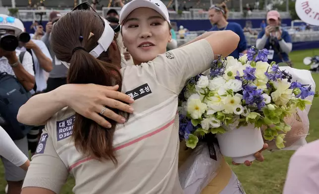 So Yeon Ryu, of South Korea, embraces fellow players after playing her final round during the second round of the Chevron Championship LPGA golf tournament Friday, April 19, 2024, at The Club at Carlton Woods, in The Woodlands, Texas. Ryu has announced she will retire after the tournament. (AP Photo/David J. Phillip)