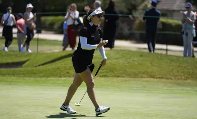 Hannah Green reacts after making a putt on the first green during the fourth round of the LPGA's JM Eagle LA Championship golf tournament at Wilshire Country Club, Sunday, April 28, 2024, in Los Angeles. (AP Photo/Ashley Landis)