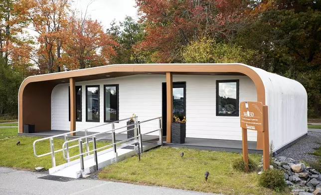 The University of Maine's first 3D printed home sits on Oct. 12, 2023, in Orono, Maine. The printer that created the house can cut construction time and labor. An even larger printer unveiled on Tuesday, April 23, 2024, may one day create entire neighborhoods. (AP Photo/Kevin Bennett)