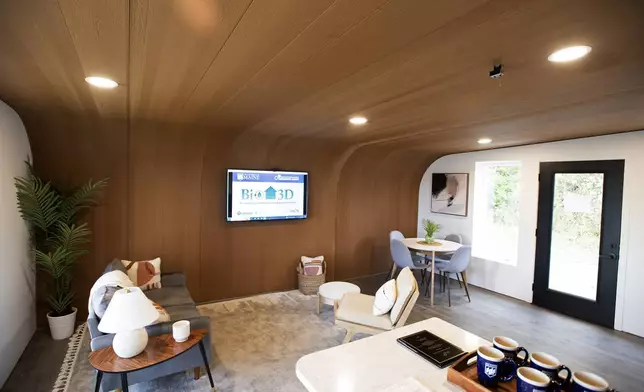 The inside of the University of Maine's first 3D printed home is visible on Oct. 12, 2023, in Orono, Maine. The printer that created the house can cut construction time and labor. An even larger printer unveiled on Tuesday, April 23, 2024, may one day create entire neighborhoods. (AP Photo/Kevin Bennett)