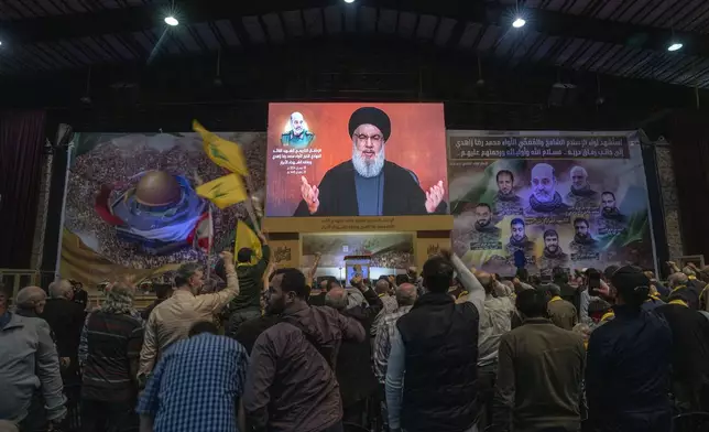 Hezbollah leader Sayyed Hassan Nasrallah speaks in a televised address via a video link during a ceremony to commemorate the death of the Iranian Revolutionary Guard Gen. Mohammad Reza Zahedi, and six officers, who were killed by an Israeli airstrike that demolished Iran's consulate in Syria last Monday, in the southern suburbs of Beirut, Monday, April 8, 2024. Nasrallah paid tribute to Zahedi, who spent 12 years of his career as a top general at the Iranian Revolutionary Guards elite Quds Force with Hezbollah. The Hezbollah leader said he played a key role in strengthening and empowering the group which fought several wars with Israel, and has become Iran's key proxy in the region. (AP Photo/Hassan Ammar)