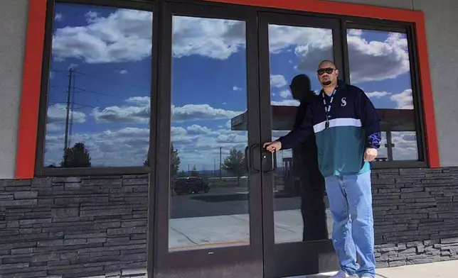 David Penn Jr., 47, poses on April 17, 2024, in front of a vacant storefront in Pasco, Washington, that he is converting into a cannabis retail outlet. Penn, who is Black, was recently awarded a marijuana sales license under a Washington state program designed to help those most harmed by the war on drugs profit from the legal industry. ( David Penn Jr. via AP)