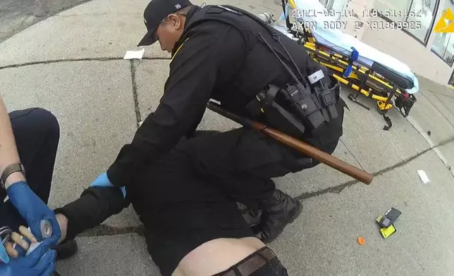 In this image from Richmond Police Department body-camera video, police restrain Ivan Gutzalenko in Richmond, Calif., on March 10, 2021. (Richmond Police Department via AP)