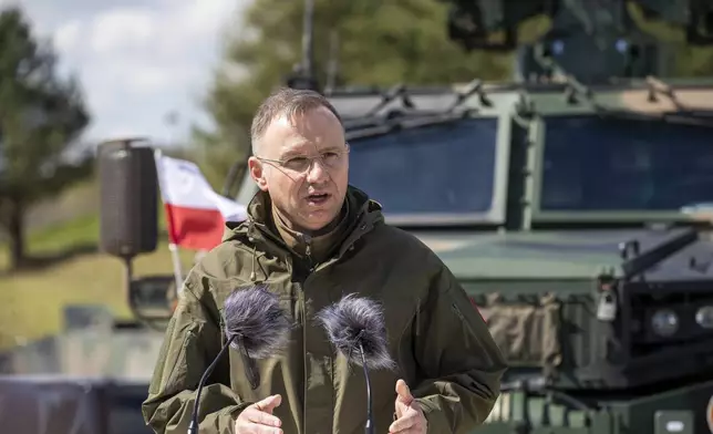 Poland's President Andrej Duda speaks during a joint media conference with Lithuania's President Gitanas Nauseda during the Lithuanian-Polish Brave Griffin 24/II military exercise near the Suwalki Gap close to the Polish border at the Dirmiskes village, Alytus district west of the capital Vilnius in Lithuania on Friday, April 26, 2024. The week-long military exercise which started April 22, is to test a defense scenario on the bilateral so-called “Orsha” plan to defend the Suwałki Gap, a corridor of almost 100 kilometers (62 miles) between the two NATO members Poland and Lithuania. (AP Photo/Mindaugas Kulbis)