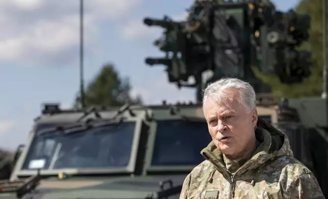 Lithuania's President Gitanas Nauseda speaks during a joint media conference with Poland's President Andrej Duda during the Lithuanian-Polish Brave Griffin 24/II military exercise near the Suwalki Gap close to the Polish border at the Dirmiskes village, Alytus district west of the capital Vilnius in Lithuania on Friday, April 26, 2024. The week-long military exercise which started April 22, is to test a defense scenario on the bilateral so-called “Orsha” plan to defend the Suwałki Gap, a corridor of almost 100 kilometers (62 miles) between the two NATO members Poland and Lithuania. (AP Photo/Mindaugas Kulbis)