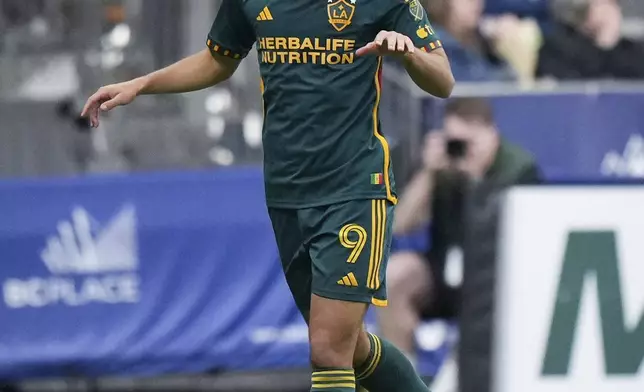 LA Galaxy's Dejan Joveljic celebrates his goal against the Vancouver Whitecaps during the second half of an MLS soccer match Saturday, April 13, 2024, in Vancouver, British Columbia. (Darryl Dyck/The Canadian Press via AP)