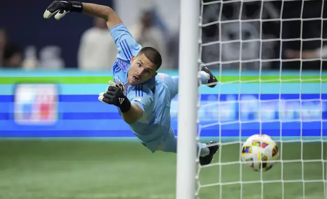 LA Galaxy goalkeeper John McCarthy allows a goal to Vancouver Whitecaps' Brian White during the second half of an MLS soccer match Saturday, April 13, 2024, in Vancouver, British Columbia. (Darryl Dyck/The Canadian Press via AP)
