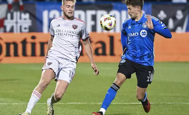 Orlando City's Duncan McGuire, left, challenges CF Montreal's Joaquin Sosa , right, during second-half MLS soccer match action in Montreal, Saturday, April 20, 2024. (Graham Hughes/The Canadian Press via AP)