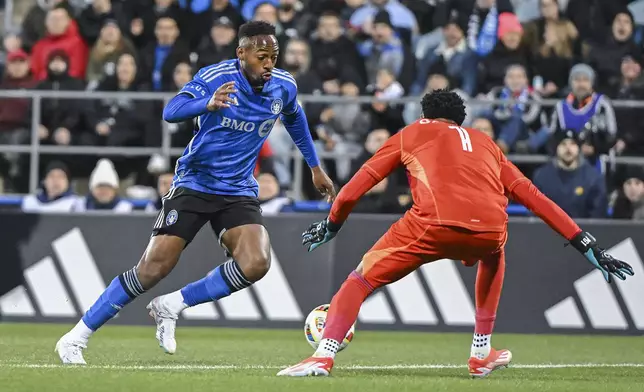 CF Montreal's Mason Toye, left, gets by Orlando City goalkeeper Pedro Gallese to score during the first half of an MLS soccer match Saturday, April 20, 2024, in Montreal. (Graham Hughes/The Canadian Press via AP)