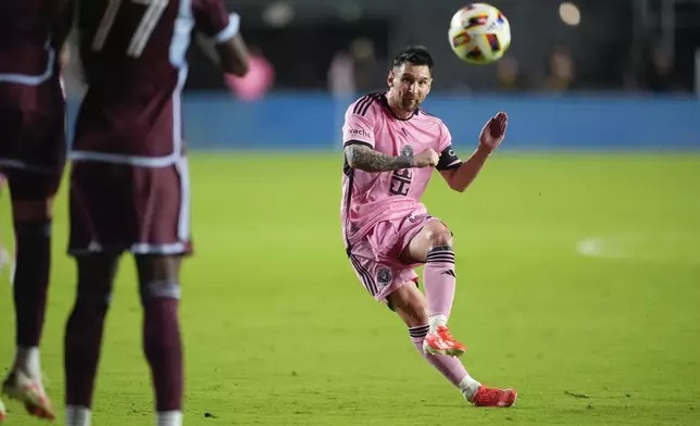 Inter Miami forward Lionel Messi, right, takes an unsuccessful free kick against the Colorado Rapids during the second half of an MLS soccer match, Saturday, April 6, 2024, in Fort Lauderdale, Fla. (AP Photo/Rebecca Blackwell)