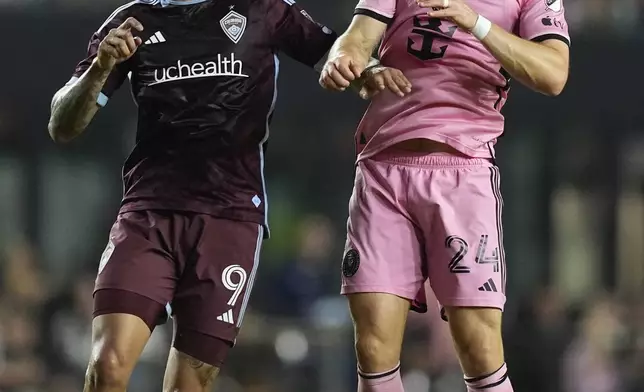 Inter Miami defender Julian Gressel (24) and Colorado Rapids forward Rafael Navarro (9) jump for a head ball during the first half of an MLS soccer match Saturday, April 6, 2024, in Fort Lauderdale, Fla. (AP Photo/Rebecca Blackwell)
