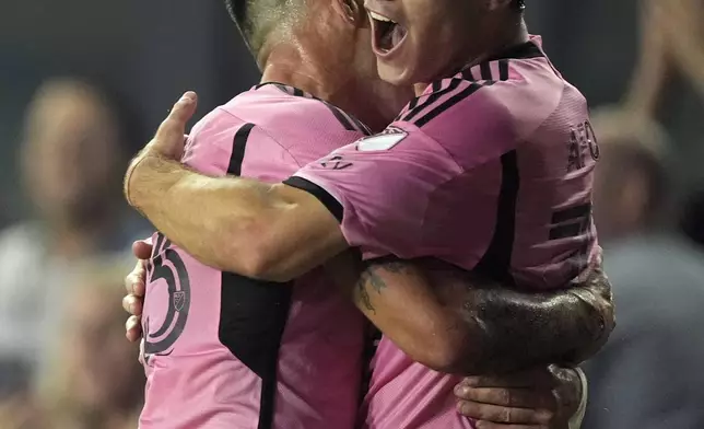 Inter Miami forward Leo Afonso, right, celebrates with teammate defender Franco Negri, left, after scoring against the Colorado Rapids during the second half of an MLS soccer match, Saturday, April 6, 2024, in Fort Lauderdale, Fla. (AP Photo/Rebecca Blackwell)