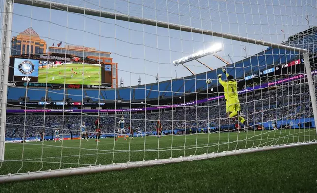 Toronto FC goalkeeper Sean Johnson blocks a Charlotte FC shot during the first half of an MLS soccer match in Charlotte, N.C., Saturday, April 13, 2024. (AP Photo/Nell Redmond)