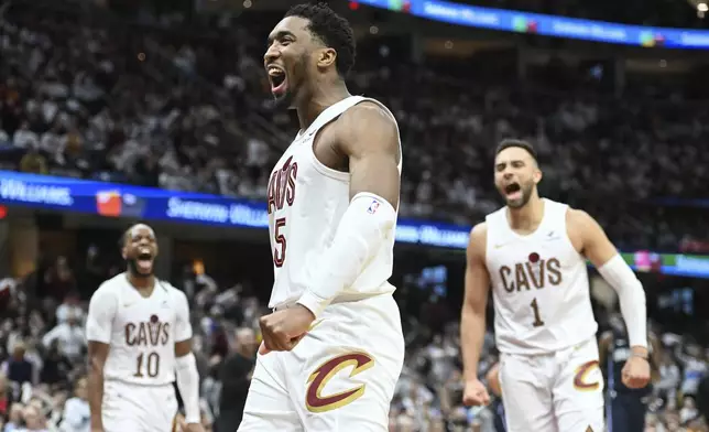 Cleveland Cavaliers' Donovan Mitchell (45) celebrates an offensive foul against the Orlando Magic during the second half in Game 1 of an NBA basketball first-round playoff series, Saturday, April 20, 2024, in Cleveland. (AP Photo/Nick Cammett)