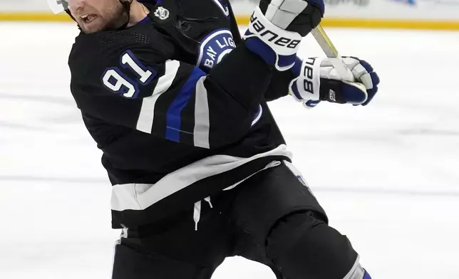 Tampa Bay Lightning center Steven Stamkos (91) fires a shot against the Toronto Maple Leafs during the second period of an NHL hockey game Wednesday, April 17, 2024, in Tampa, Fla. (AP Photo/Chris O'Meara)