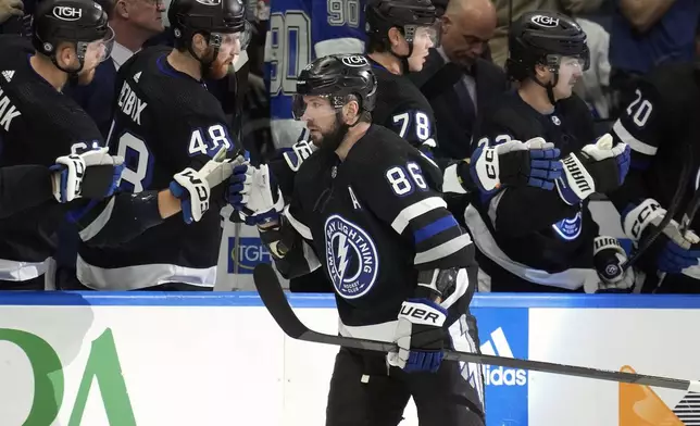 Tampa Bay Lightning right wing Nikita Kucherov (86) celebrates with the bench after his goal against the Toronto Maple Leafs during the first period of an NHL hockey game Wednesday, April 17, 2024, in Tampa, Fla. (AP Photo/Chris O'Meara)