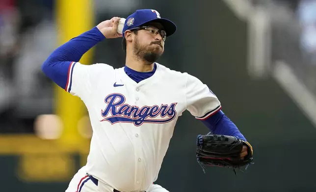 Texas Rangers starting pitcher Dane Dunning throws to the Seattle Mariners in the first inning of a baseball game in Arlington, Texas, Tuesday, April 23, 2024. (AP Photo/Tony Gutierrez)