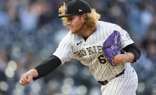 Colorado Rockies relief pitcher Noah Davis works against the Seattle Mariners in the fourth inning of the second game of a baseball doubleheader Sunday, April 21, 2024, in Denver. (AP Photo/David Zalubowski)