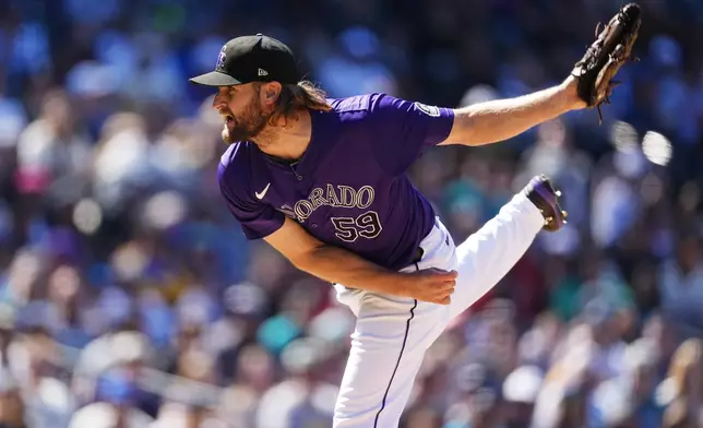 Colorado Rockies relief pitcher Jake Bird works against the Seattle Mariners in the seventh inning of the first game of a baseball doubleheader Sunday, April 21, 2024, in Denver. (AP Photo/David Zalubowski)