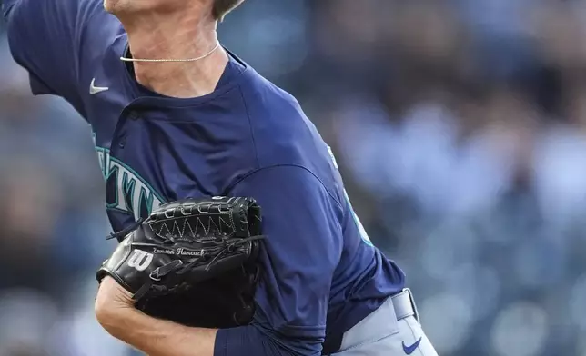 Seattle Mariners starting pitcher Emerson Hancock works against the Colorado Rockies in the first inning of the second game of a baseball doubleheader Sunday, April 21, 2024, in Denver. (AP Photo/David Zalubowski)