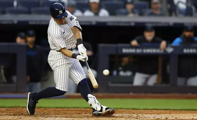 New York Yankees' Anthony Volpe hits a home run against the Miami Marlins during the fourth inning of a baseball game, Monday, April 8, 2024 in New York. (AP Photo/Noah K. Murray)