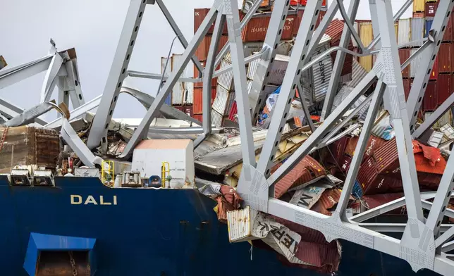 A section of the container ship Dali is seen with the collapsed Francis Scott Key Bridge upon it, as seen from the debris retrieval vessel Reynolds, April 4, 2024, in Baltimore. (Kaitlin Newman/The Baltimore Banner via AP)