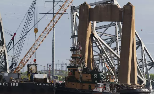 Salvage work continues on the collapsed Francis Scott Key Bridge, Thursday, April 25, 2024, in Baltimore. (AP Photo/Matt Rourke)